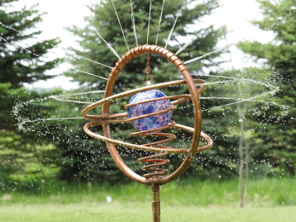 Glass witch ball in a Dream Sprayer copper art sprinkler